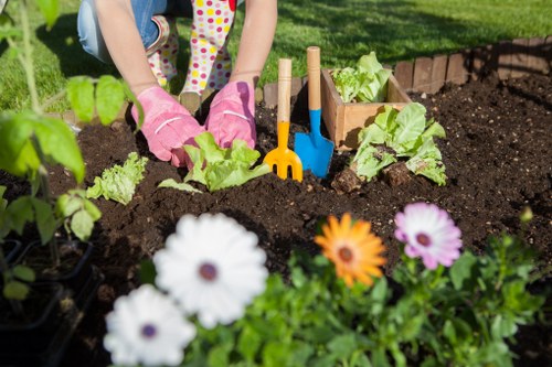 Close-up of garden tools and a readable information sign for accessibility
